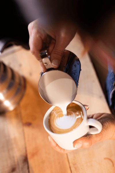 Barista pouring coffee